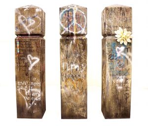 Graham Dolphin | Bollards (Amy Winehouse) | 2021 | Wood, spray paint, ink, cotton, plastic, paper, metal, wax, tippex, graphite, dirt | Each piece is 90x20x20cm